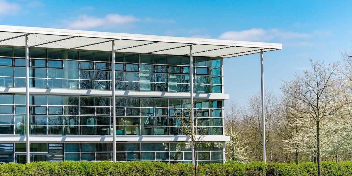 glass-office-building-green-city glass-office-building-green-city